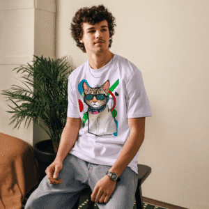 Man sitting indoors wearing lavender Cool Cat T-Shirt – cat graphic tee with sunglasses design by AmizDesign